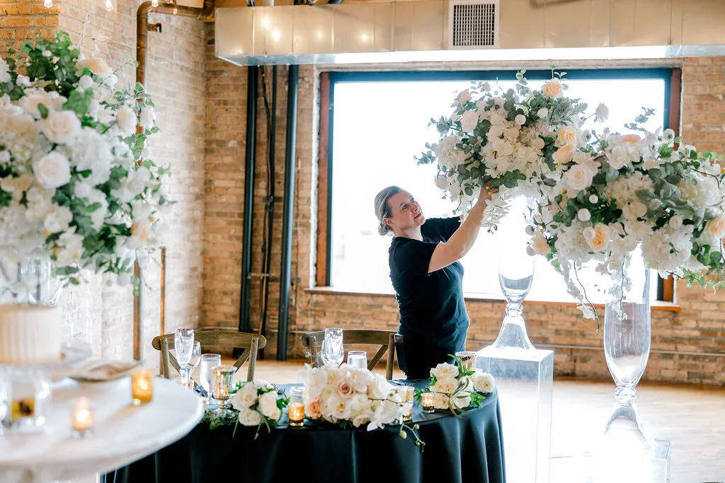 The master florist arranging tall white florals — YJDecorating